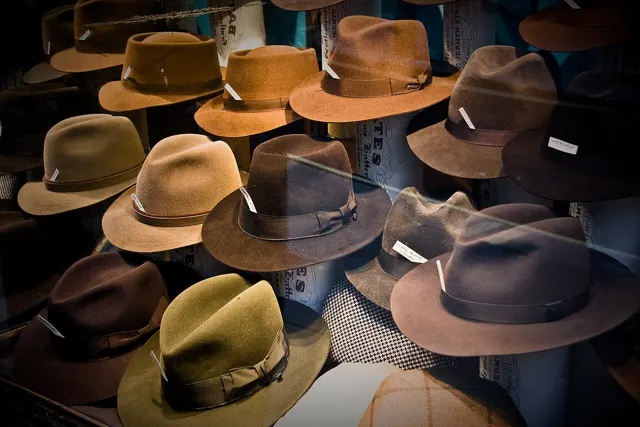 Brimmed hats of different sizes on display