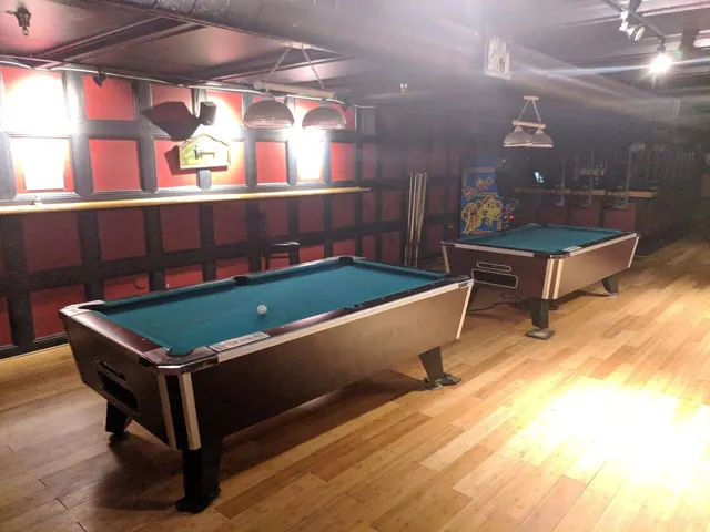 Pool tables in a games room